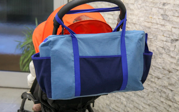 Le sac de maternité est fait pour être accroché à une poussette de bébé